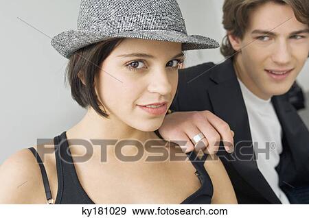 Portrait of a young woman with a teenage boy looking at her View Large Photo Image Stock Photo - Portrait of a young woman with a teenage boy looking at her. Fotosearch