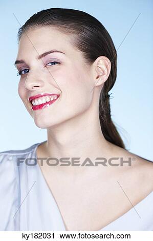 Portrait of smiling young woman View Large Photo Image Stock Image - Portrait of smiling young woman. Fotosearch