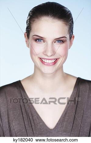 Portrait of smiling young woman View Large Photo Image Stock Image - Portrait of smiling young woman. Fotosearch