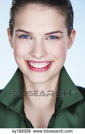 Portrait of smiling young woman View Large Photo Image Stock Photo - Portrait of smiling young woman. Fotosearch