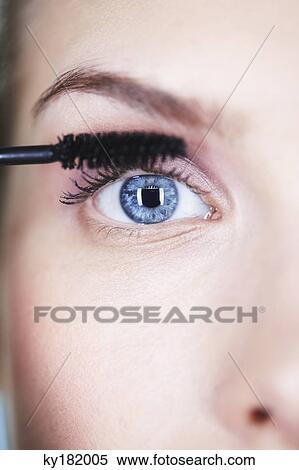 Woman applying mascara View Large Photo Image Stock Photography - Woman applying mascara. Fotosearch