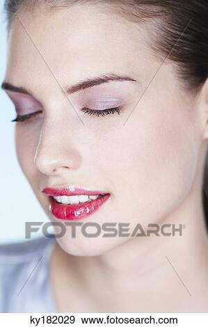 Young woman with eyes closed View Large Photo Image Stock Photo - Young woman with eyes closed. Fotosearch