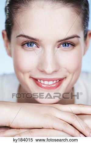 Stock Photography - Portrait of young smiling woman. Fotosearch