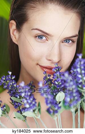 Young woman holding lavender sprigs View Large Photo Image Stock Photography - Young woman holding lavender sprigs. Fotosearch