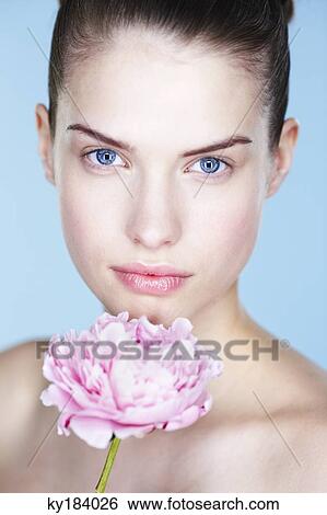 Young woman holding peony View Large Photo Image Stock Photograph - Young woman holding peony. Fotosearch
