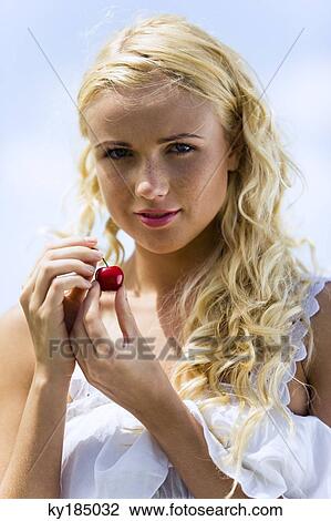 Portrait of young woman with cherries View Large Photo Image Stock Image - Portrait of young woman with cherries. Fotosearch