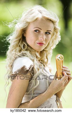 Young woman eating enchiladas View Large Photo Image Stock Image - Young woman eating enchiladas. Fotosearch