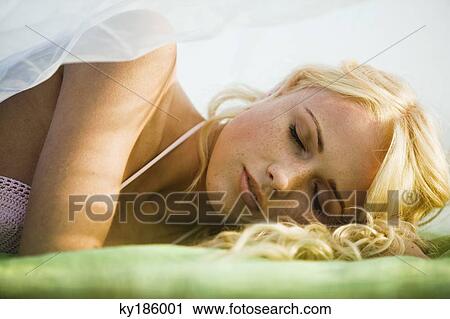Young woman lying View Large Photo Image Stock Image - Young woman lying. Fotosearch