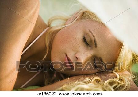 Young woman lying View Large Photo Image Stock Image - Young woman lying. Fotosearch
