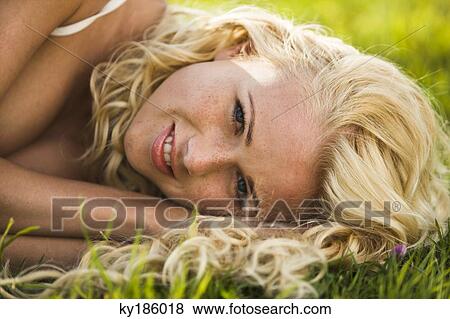 Stock Photo - Young woman lying. Fotosearch