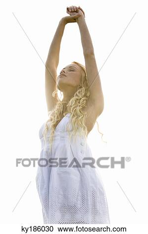 Young woman, stretching View Large Photo Image Stock Image - Young woman, stretching. Fotosearch