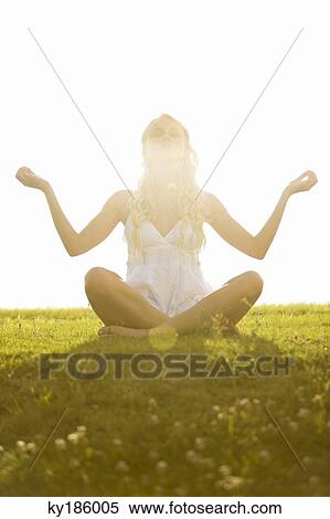 Young woman, yoga attitude View Large Photo Image Stock Photography - Young woman, yoga attitude. Fotosearch