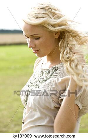 Portrait of a young woman View Large Photo Image Stock Photo - Portrait of a young woman. Fotosearch