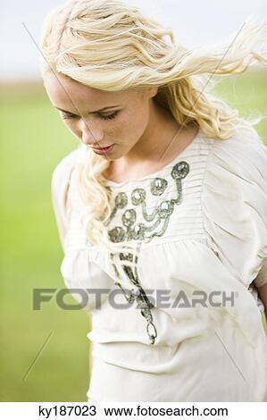 Young woman, outdoors View Large Photo Image Stock Image - Young woman, outdoors. Fotosearch