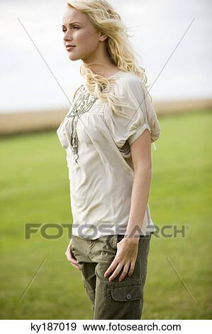 Young woman, outdoors View Large Photo Image Stock Photo - Young woman, outdoors. Fotosearch
