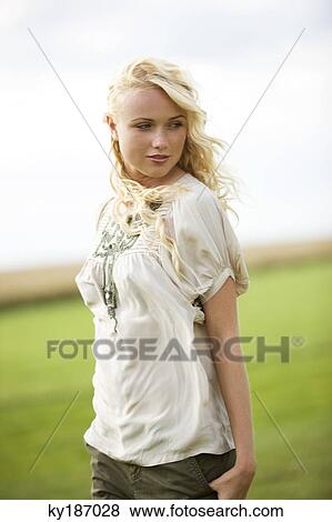 Young woman, outdoors View Large Photo Image Stock Photo - Young woman, outdoors. Fotosearch