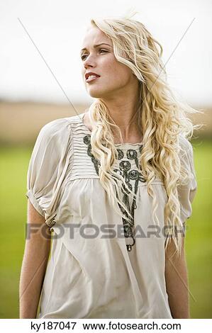 Young woman, outdoors View Large Photo Image Stock Photo - Young woman, outdoors. Fotosearch