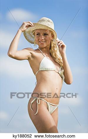 Young woman wearing bathsuit and hat View Large Photo Image Stock Image - Young woman wearing bathsuit and hat. Fotosearch