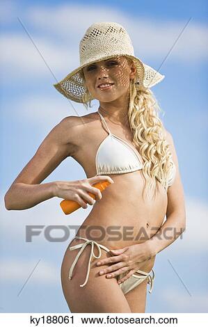 Young woman wearing bathsuit and spray View Large Photo Image Stock Image - Young woman wearing bathsuit and spray. Fotosearch