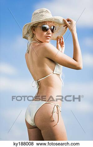Young woman wearing bathsuit, hat, sunglasses View Large Photo Image Stock Photo - Young woman wearing bathsuit, hat, sunglasses. Fotosearch