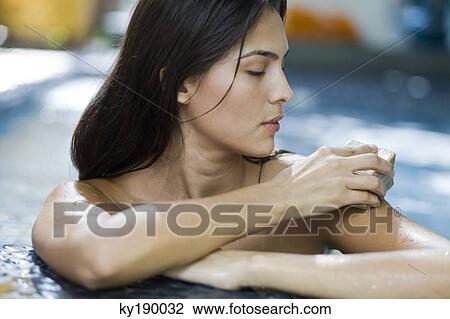 Woman applying a bar of soap on her skin View Large Photo Image Stock Image - Woman applying a bar of soap on her skin. Fotosearch