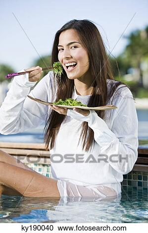 Woman eating seaweed with chopsticks View Large Photo Image Stock Image - Woman eating seaweed with chopsticks. Fotosearch