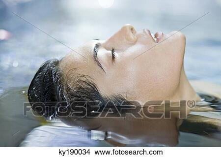 Picture - Woman in a swimming pool. Fotosearch