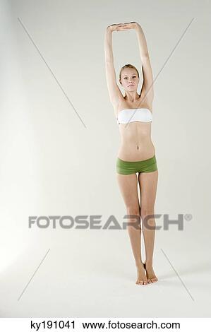 Portrait of a woman exercising View Large Photo Image Stock Image - Portrait of a woman exercising. Fotosearch