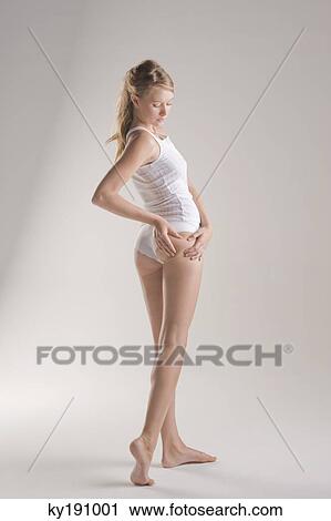 Woman examining her skin View Large Photo Image Stock Image - Woman examining her skin. Fotosearch