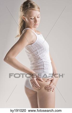 Woman examining her skin View Large Photo Image Stock Image - Woman examining her skin. Fotosearch