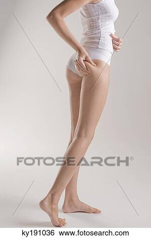 Woman examining her skin View Large Photo Image Stock Photograph - Woman examining her skin. Fotosearch