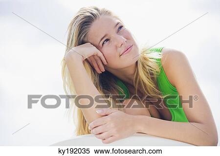 Close-up of a woman day dreaming View Large Photo Image Stock Photography - Close-up of a woman day dreaming. Fotosearch