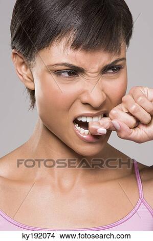 Close-up of a woman looking frustrated View Large Photo Image Picture - Close-up of a woman looking frustrated. Fotosearch