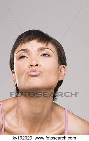 Close-up of a woman puckering lips View Large Photo Image Stock Image - Close-up of a woman puckering lips. Fotosearch