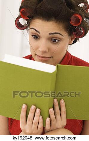 Stock Photo - Close-up of a woman reading a book. Fotosearch