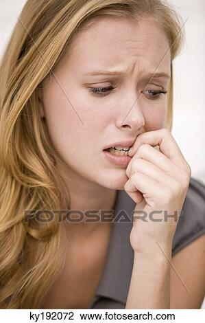 Stock Image - Close-up of a woman thinking. Fotosearch