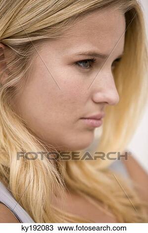 Close-up of a woman thinking View Large Photo Image Stock Image - Close-up of a woman thinking. Fotosearch
