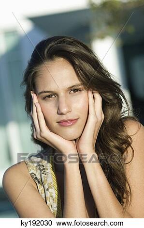 Stock Image - Portrait of a woman thinking. Fotosearch