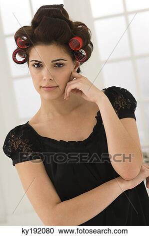 Portrait of a woman with hair curlers in her hair View Large Photo Image Stock Image - Portrait of a woman with hair curlers in her hair. Fotosearch