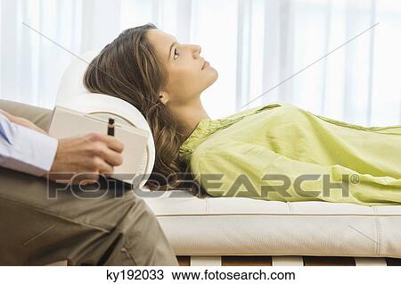 Stock Image - Psychiatrist examining a female patient. Fotosearch