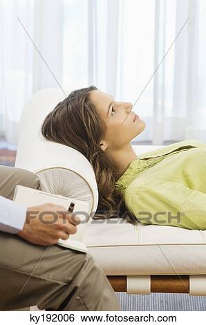 Stock Photograph - Psychiatrist examining a female patient. Fotosearch
