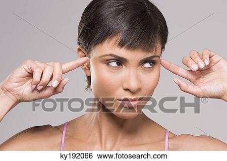 Woman rubbing her temples View Large Photo Image Stock Photograph - Woman rubbing her temples. Fotosearch