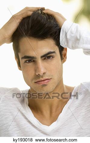Man with his hands in his hair View Large Photo Image Stock Photo - Man with his hands in his hair. Fotosearch
