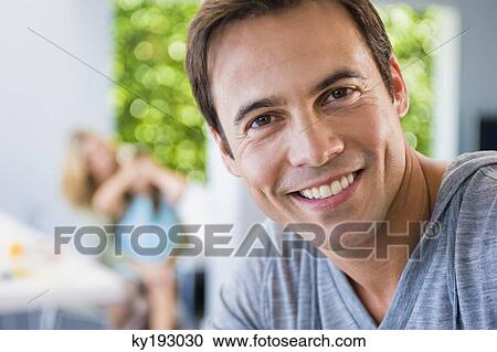 Stock Image - Portrait of a man smiling. Fotosearch