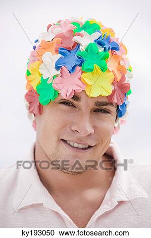 Portrait of a man wearing a flower cap View Large Photo Image Stock Image - Portrait of a man wearing a flower cap. Fotosearch