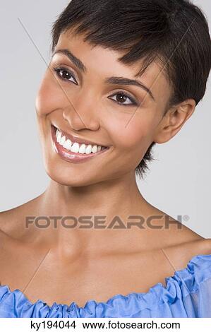 Close-up of a woman smiling View Large Photo Image Picture - Close-up of a woman smiling. Fotosearch