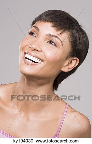 Close-up of a woman smiling View Large Photo Image Stock Image - Close-up of a woman smiling. Fotosearch