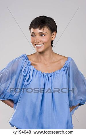 Close-up of a woman smiling View Large Photo Image Stock Photo - Close-up of a woman smiling. Fotosearch