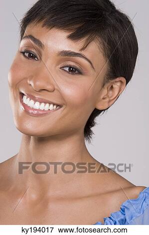 Portrait of a woman smiling View Large Photo Image Stock Photo - Portrait of a woman smiling. Fotosearch