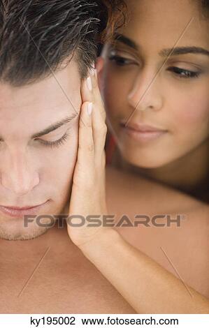 Stock Image - Close-up of a couple romancing. Fotosearch